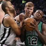 Boston MA 11/25/16 Boston Celtics Terry Rozier is fouled by San Antonio Spurs Tony Parker enroute to a 3-point play during fourth quarter action at the TD Garden. (Photo by Matthew J. Lee/Globe staff) topic: reporter: 