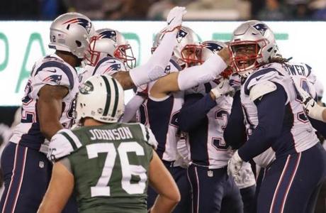 The New England Patriots celebrate a missed field goal by the New York Jets during the second quarter of an NFL football game, Sunday, Nov. 27, 2016, in East Rutherford, N.J. (AP Photo/Julio Cortez)
