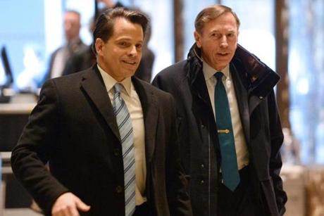 David Petraeus (right) was seen arriving in the lobby of Trump Tower Monday.
