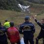 Rescuers gesture near the wreckage of the LAMIA airlines charter plane carrying members of the Chapecoense Real football team that crashed in the mountains of Cerro Gordo, municipality of La Union, on November 29, 2016. A charter plane carrying the Chapocoense Real football team crashed in the mountains in Colombia late Monday, killing as many as 75 people, officials said. / AFP PHOTO / Raul ARBOLEDARAUL ARBOLEDA/AFP/Getty Images