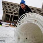 Nick Norris  and Scott Grealish of Ice Rink Events rolled tubing for the skating path ahead of the opening of ?Boston Winter? at City Hall Plaza. Antifreeze is used in the tubing to freeze the water.