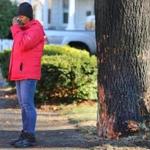 An emotional Regina Lewis stood near the tree on Brush Hill Road where the youngest of her six children died in a fiery car crash early Friday. 