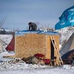 An activist built a shelter on the edge of the Standing Rock Sioux Reservation on Saturday.