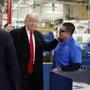 President-elect Donald Trump talks with workers during a visit to the Carrier factory, Thursday, Dec. 1, 2016, in Indianapolis, Ind. (AP Photo/Evan Vucci)