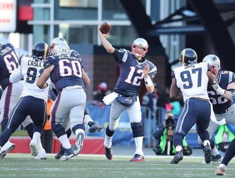 Foxborough, MA - 12-4-16 - New England Patriots Tom Brady throws a pass against the Los Angeles Rams during third quarter action at Gillette Stadium. (Matthew J. Lee/Globe staff)
