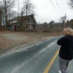 03/24/16: Dudley, MA: Dudley resident Desiree Moninski is pictured walking across the street from her house to the site where the Islamic Society of Greater Worcester wants to build a Muslim Cemetery. (Globe Staff Photo/Jim Davis) section:metro topic:26cemeterys1