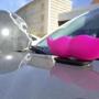 The signature pink mustache of ride-booking company Lyft sits on the hood of a vehicle during a news conference in Albuquerque, N.M., on Thursday, Aug. 18, 2016. Legislation signed earlier this year cleared up regulatory uncertainty and allowed for Lyft and other ride-booking services, like Uber, to resume operations in the state. (AP Photo/Susan Montoya Bryan)