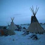 CANNON BALL, ND - DECEMBER 06: Activists at Oceti Sakowin near the Standing Rock Sioux Reservation brace for sub-zero temperatures expected overnight on December 6, 2016 outside Cannon Ball, North Dakota. Native Americans and activists from around the country have been at the camp for several months trying to halt the construction of the Dakota Access Pipeline. The proposed 1,172-mile-long pipeline would transport oil from the North Dakota Bakken region through South Dakota, Iowa and into Illinois. (Photo by Scott Olson/Getty Images)