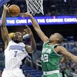 Orlando Magic's Serge Ibaka (7) is fouled as he goes to the basket against Boston Celtics' Al Horford (42) during the first half of an NBA basketball game, Wednesday, Dec. 7, 2016, in Orlando, Fla. (AP Photo/John Raoux)