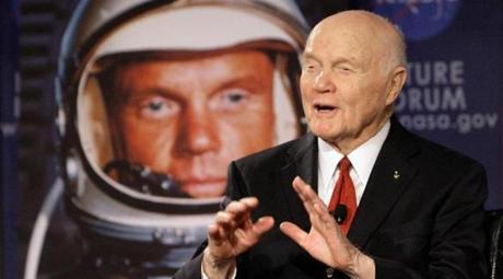 FILE - In this Feb. 20, 2012, file photo, U.S. Sen. John Glenn talks with astronauts on the International Space Station via satellite in Columbus, Ohio. Changing Port Columbusâ?? name to John Glenn Columbus International Airport will cost an estimated $775,000 in new signs, according to a newly released study. The airport was named in honor of the astronaut and former U.S. senator in June 2016. The 95-year-old Ohio native was the first American to orbit the earth. (AP Photo/Jay LaPrete, File)

