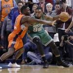 Boston Celtics forward Jae Crowder (99) drives to the basket as Oklahoma City Thunder guard Victor Oladipo (5) defends during the first half of an NBA basketball game in Oklahoma City, Sunday, Dec. 11, 2016. (AP Photo/Alonzo Adams)