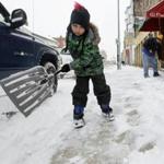 A 7-year-old in Dubuque, Iowa, helped his father shovel on Sunday after a storm dumped heavy snow in the region.