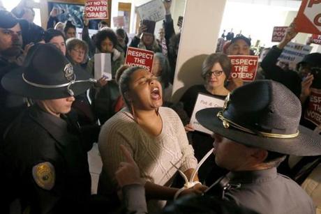 A protestor shouts as she is arrested outside the House gallery during a special session of the North Carolina General Assembly in Raleigh Friday.
