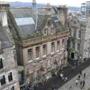 Shops and pedestrians along Edinburgh?s busy Royal Mile, as seen from above.