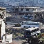 A bus entered the southern outskirts of Aleppo to evacuate besieged residents. The effort was halted later Sunday.