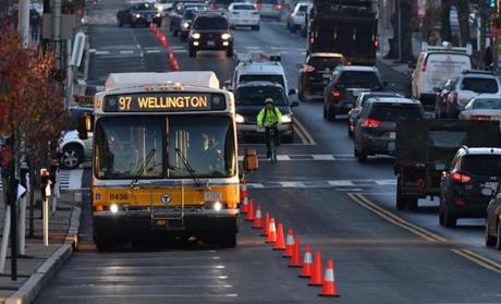 08bus - An MBTA bus drives down a dedicated lane converted from parking spaces on Broadway in Everett during a one week trial. The MBTA could use the project as a way to encourage other bus-only lane tests in traffic-snarled Boston. (Josh Reynolds for The Boston Globe)
