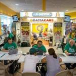 Customers signed up for coverage under the Affordable Care Act at a mall kiosk in Miami last month.