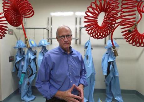 BOSTON, MA - 8/19/2014: BUÕs National Emerging Infectious Diseases Laboratories on Albany Street, Boston. Dr. Ron Corley, the biolab's associate director stands in the Bio Safety Lab Level 4 with positive pressure protection suits. (David L Ryan/Globe Staff Photo) SECTION: METRO TOPIC 22biolab(2)
