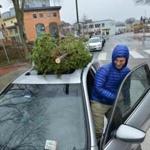 Brad Freseman of Somerville got ready to drive away with the Christmas tree he bought on Christmas Eve day.