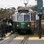 Boston, MA - 10/30/2016 - Passengers board an MBTA Greene Line train at the intersection of Commonwealth Avenue and Harvard Street in the Allston neighborhood of Boston, MA, October 30, 2016. (Keith Bedford/Globe Staff)
