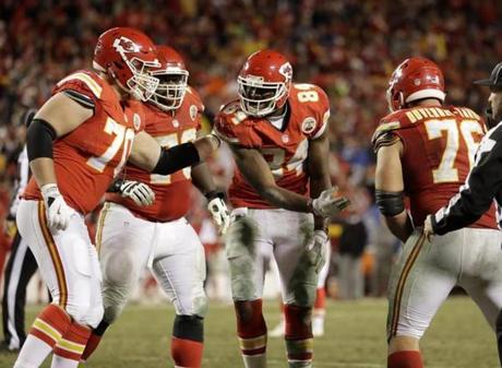 Kansas City Chiefs tight end Demetrius Harris (84) celebrates with teammates after he caught a touchdown ball during the second half of an NFL football game against the Denver Broncos in Kansas City, Mo., Sunday, Dec. 25, 2016. (AP Photo/Charlie Riedel)
