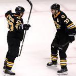 Boston, MA: 12-20-16: FOR USE WITH FUTURE STORY..........The Bruins Patrice Bergeron (eft) and Brad Marchand (right) ae pictured on the ice together during the game. The Boston Bruins hosted the New York Islanders in a regular season NHL game at the TD Garden. (Globe Staff Photo/Jim Davis) reporter: dupont topic: Bruins-Islanders 