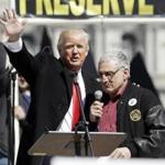 FILE - In this April 1, 2014, file photo, Donald Trump, left, is joined by Carl Paladino during a gun rights rally at the Empire State Plaza in Albany, N.Y. Paladino, who co-chaired president-Elect Donald Trump's state campaign, confirmed to The Associated Press on Friday, Dec. 23, 3016 that he told a New York alternative newspaper he hoped President Barack Obama would die from mad cow disease and that the first lady would 