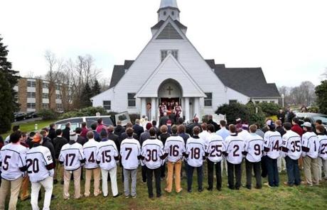Teammates of James Lavin, who died last week in a car crash, stood outside St. Patrick Church for his funeral. 
