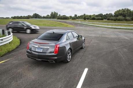 techlab - A 2015 Cadillac CTS, equipped with V2V technology, notifies the driver of the approaching Cadillac SRX from the left before the driver could see the vehicle. (Cadillac)
