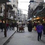 People walked in a street in Aleppo, Syria, on Thursday.