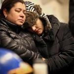 East Boston residents and activists Claudia Sierra, left, and Veronica Robles comforted each other during a vigil at Sartori Memorial Stadium in East Boston on Thursday.