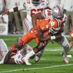 Clemson quarterback Deshaun Watson was hauled down by Ohio State?s Dre'Mont Jones (86) and Tyquan Lewis (59) in the first half. 