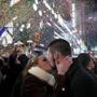 Kaitlin Olivi of Yonkers, N.Y., and Lucas Pereira, of Sayreville, N.J., kiss as confetti falls during a celebration of the new year in New York's Times Square, Sunday, Jan. 1, 2017. (AP Photo/Craig Ruttle)