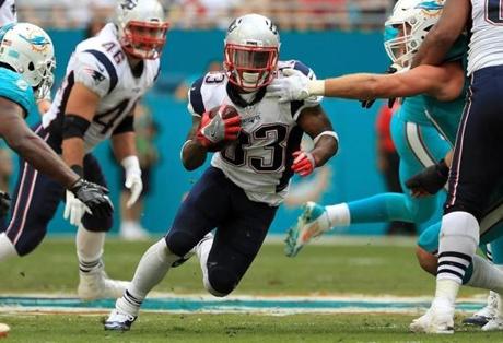 MIAMI GARDENS, FL - JANUARY 01: Dion Lewis #33 of the New England Patriots rushes during a game against the Miami Dolphins at Hard Rock Stadium on January 1, 2017 in Miami Gardens, Florida. (Photo by Mike Ehrmann/Getty Images)
