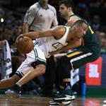 Boston, MA 1-3-17: The Celtics Avery Bradley takes a low angle approach as he drives on Utah's Raul Neto in the first half. The Boston Celtics hosted the Utah Jazz in a regular season NBA basketball game at the TD Garden. (Globe Staff Photo/Jim Davis) reporter: himmelsbach topic: Celtics-Jazz