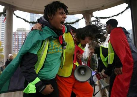 Boston, MA -- 12/5/2016 - Luis Navarro, 19, a student at Boston Day and Evening Academy (L) and Erik Lazo a student at Snowden International chant together as Boston High School students walkout to protest the election of Donald Trump. (Jessica Rinaldi/Globe Staff) Topic: 06walkoutpic Reporter:
