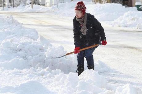Debra Packard shoveled her driveway in Fitchburg last week. 
