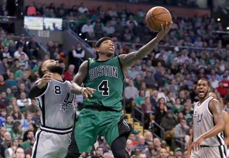 Boston MA 11/25/16 Boston Celtics Isaiah Thomas drives to the basket beating San Antonio Spurs Patty Mills during fourth quarter action at the TD Garden. (Photo by Matthew J. Lee/Globe staff) topic: reporter: 

