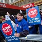 Unionized Postal Service workers protested outside a Staples store in April 2014. 