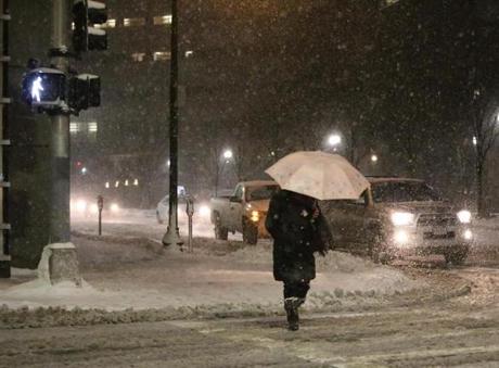 A pedestrian crossed Kneeland Street in Boston during Saturday?s storm.  
