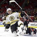 Boston Bruins' Tim Schaller celebrates his goal during the first period of an NHL hockey game against the Carolina Hurricanes in Raleigh, N.C., Sunday, Jan. 8, 2017. (AP Photo/Gerry Broome)