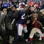 Patriots running back LeGarrette Blount celebrates a touchdown run with the End Zone Militia. 