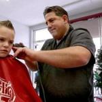 12-17-2106: Saugus, MA: Barber Mike Moriello gives a haircut to Anthony Wyzanski (age 6, left) at George's Barber Shop in Saugus, Mass. Dec. 17, 2016. Photo/ John Blanding, Boston Globe staff story/Cindy Atoji Keene, Business ( 15onthejob )