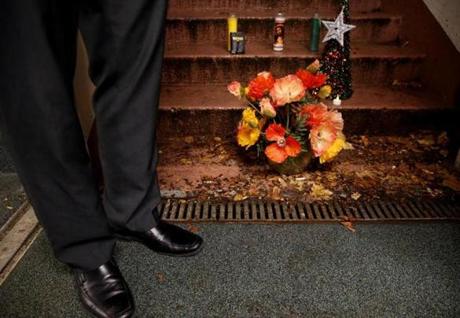 A small memorial was placed on the steps where Luis Fernando Orellana Ruano was found dead, during a vigil at Sartori Memorial Stadium in East Boston on Dec. 29, 2016.
