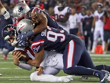 Houston quarterback Brock Osweiler was sacked by Patriots players Jabaal Sheard and Trey Flowers in September.

