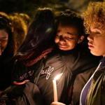 Mourners attend a candlelight vigil at Lawrence High School after it was announced that it was the body of missing student Lee Manuel Viloria-Paulino, 16, had been found along the banks of the Merrimack River . JOSH REYNOLDS FOR THE BOSTON GLOBE (Metro, )