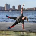 Sarah Coughlin from Dorchester practiced her yoga routine on a dock on the Charles River Esplanade on Thursday. 