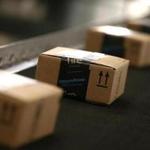 FILE - JANUARY 12: Amazon.com, the world's largest online retailer, said it will add 100,000 full-time U.S. employees over the next 18 months. TRACY, CA - JANUARY 20: Boxes move along a conveyor belt at an Amazon fulfillment center on January 20, 2015 in Tracy, California. Amazon officially opened its new 1.2 million square foot fulfillment center in Tracy, California that employs more than 1,500 full time workers as well as 3,000 Kiva robots that can fetch merchandise for workers and are capable of lifting up to 750 pounds. Amazon is currently using 15,000 of the robots spread over 10 fulfillment centers across the country. (Photo by Justin Sullivan/Getty Images)