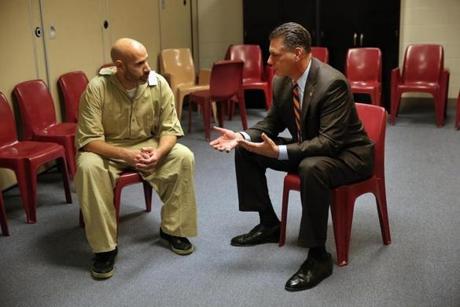 Middlesex County Sheriff Peter Koutoujian (right) spoke with inmate and military veteran Michael Wiggins in 2013.

