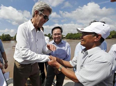 John Kerry shook hands with Vo Ban Tam, a former Viet Cong soldier. The two were adversaries in a firefight on the Bay Hap River on Feb. 28, 1969.
